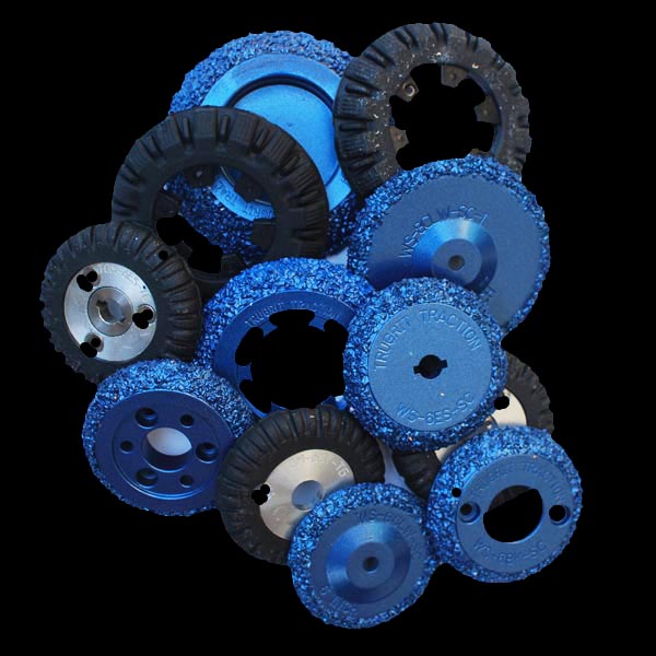 Pile of various sewer crawler wheels manufactured and sold by TruGrit Traction, showcasing a range of durable options for sewer camera crawler applications.